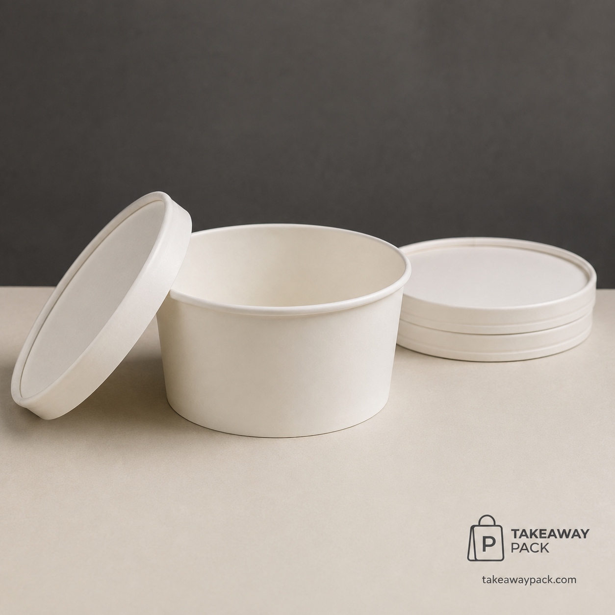 White paper takeaway bowl with matching lids on a neutral background