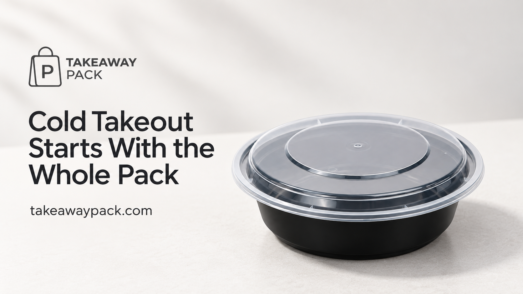 Black round takeaway bowl with a clear lid.