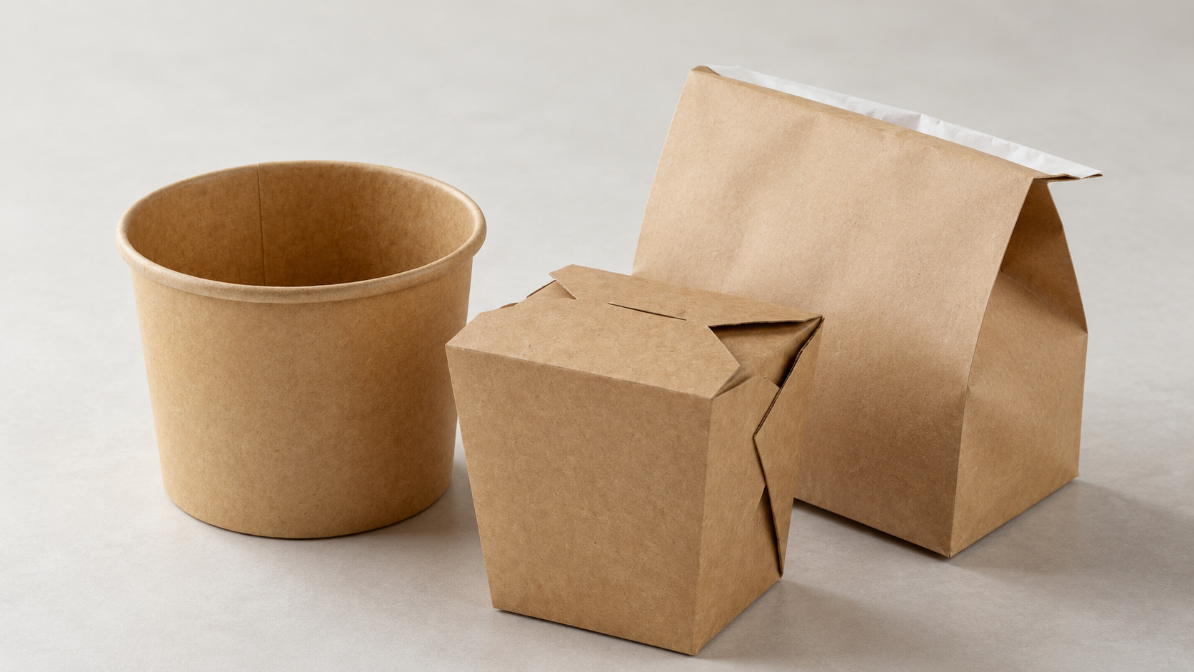 Stack of corrugated shipping cartons and food containers in a warehouse loading area