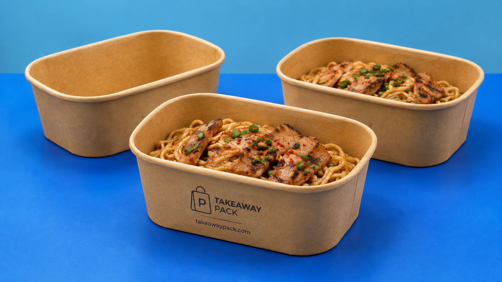 Kraft rectangular takeaway boxes on a blue surface under soft light