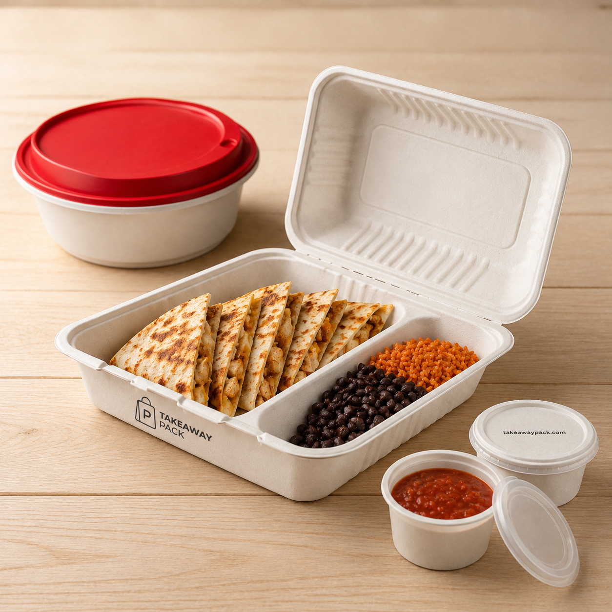 A wrap cut into triangles sits in a white foam container with black beans and red and orange sauces, the printed lid resting alongside on a wooden table.