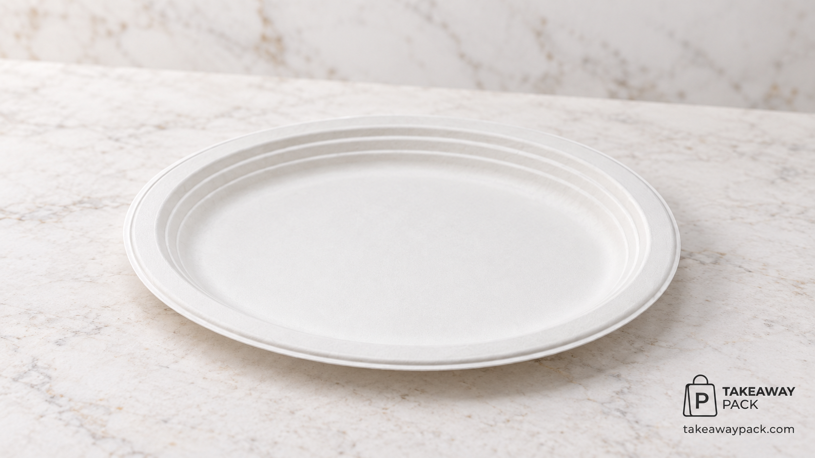 Plain white round disposable plate with a ridged rim sitting empty on a pale marble surface.
