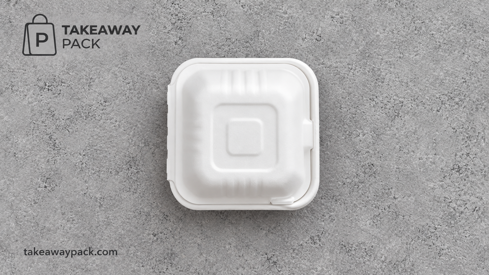 Closed white foam clamshell container on a grey textured surface.