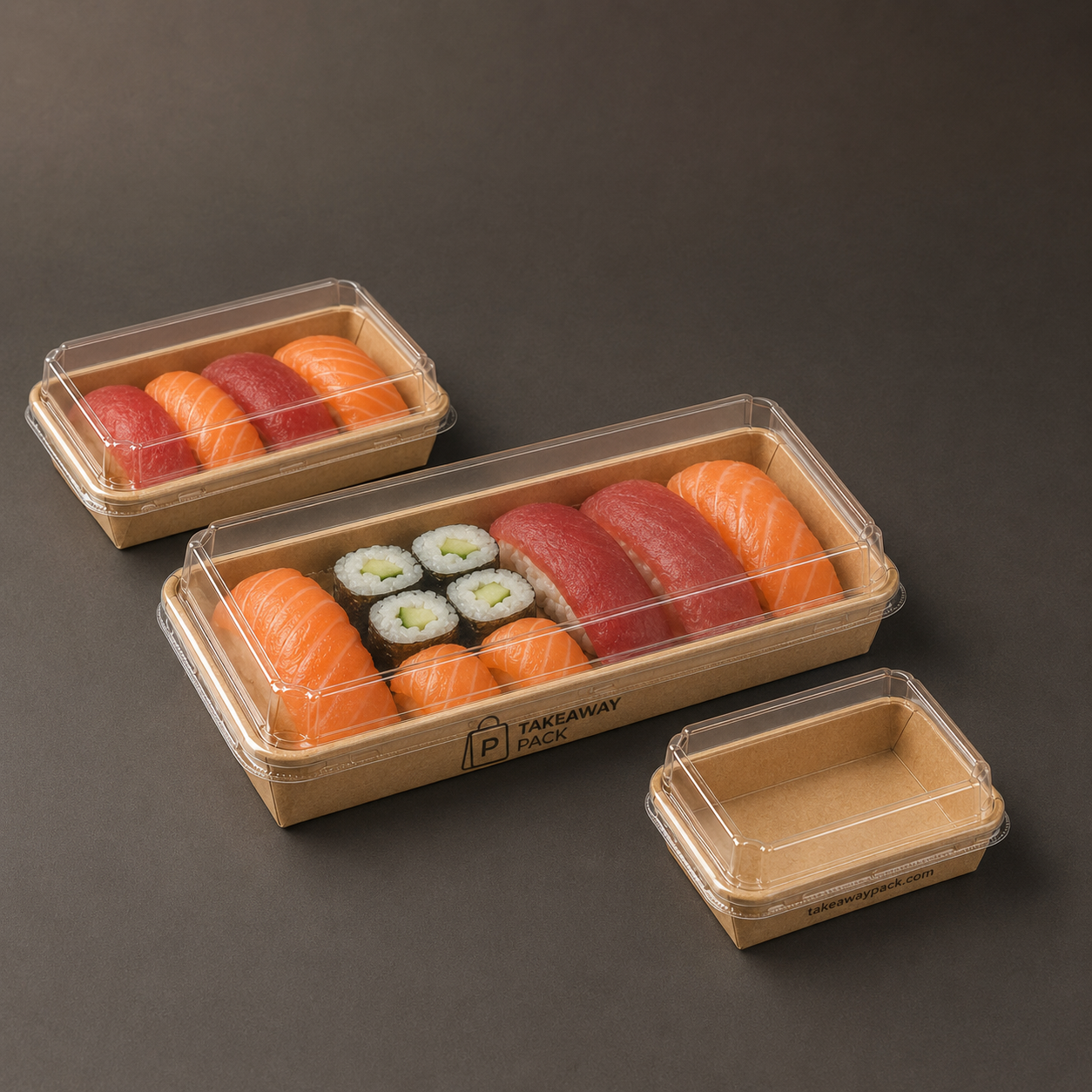 Three kraft paper sushi boxes of different sizes with clear plastic lids: two hold assorted sushi pieces and the third is empty, all printed with a brand name.