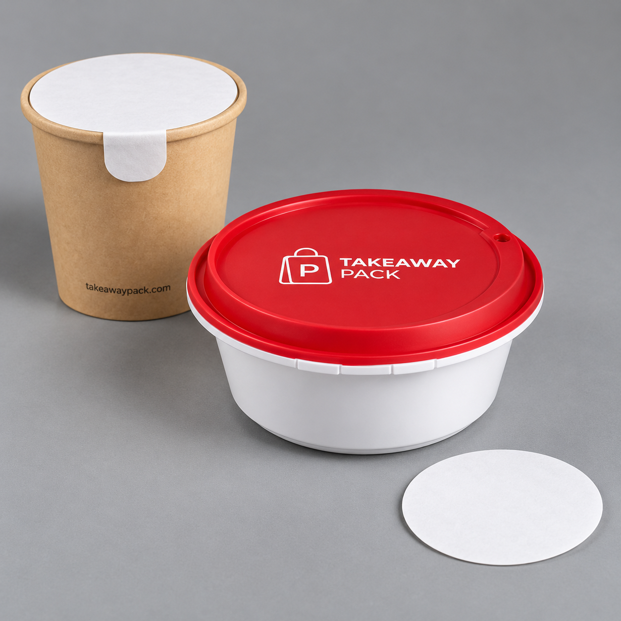 A brown kraft paper cup printed with a web address and fitted with a white paper seal disc, a red-and-white plastic tub with a printed red lid, and a loose white paper seal disc.