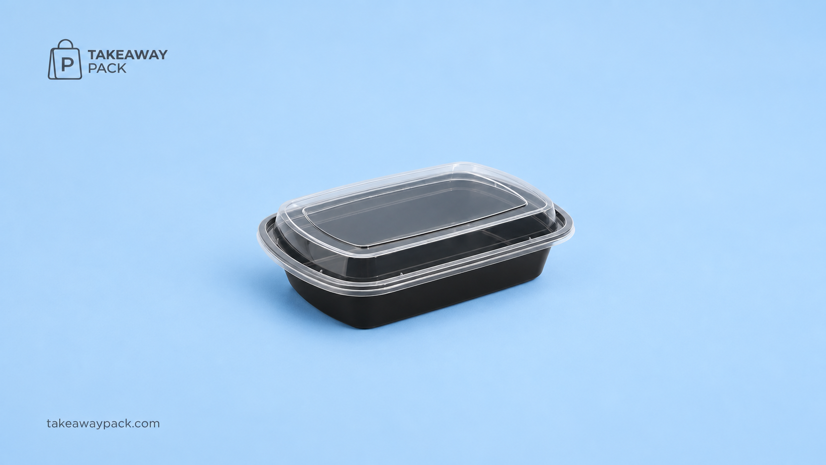 Black rectangular meal-prep tray with a clear lid on a blue background.