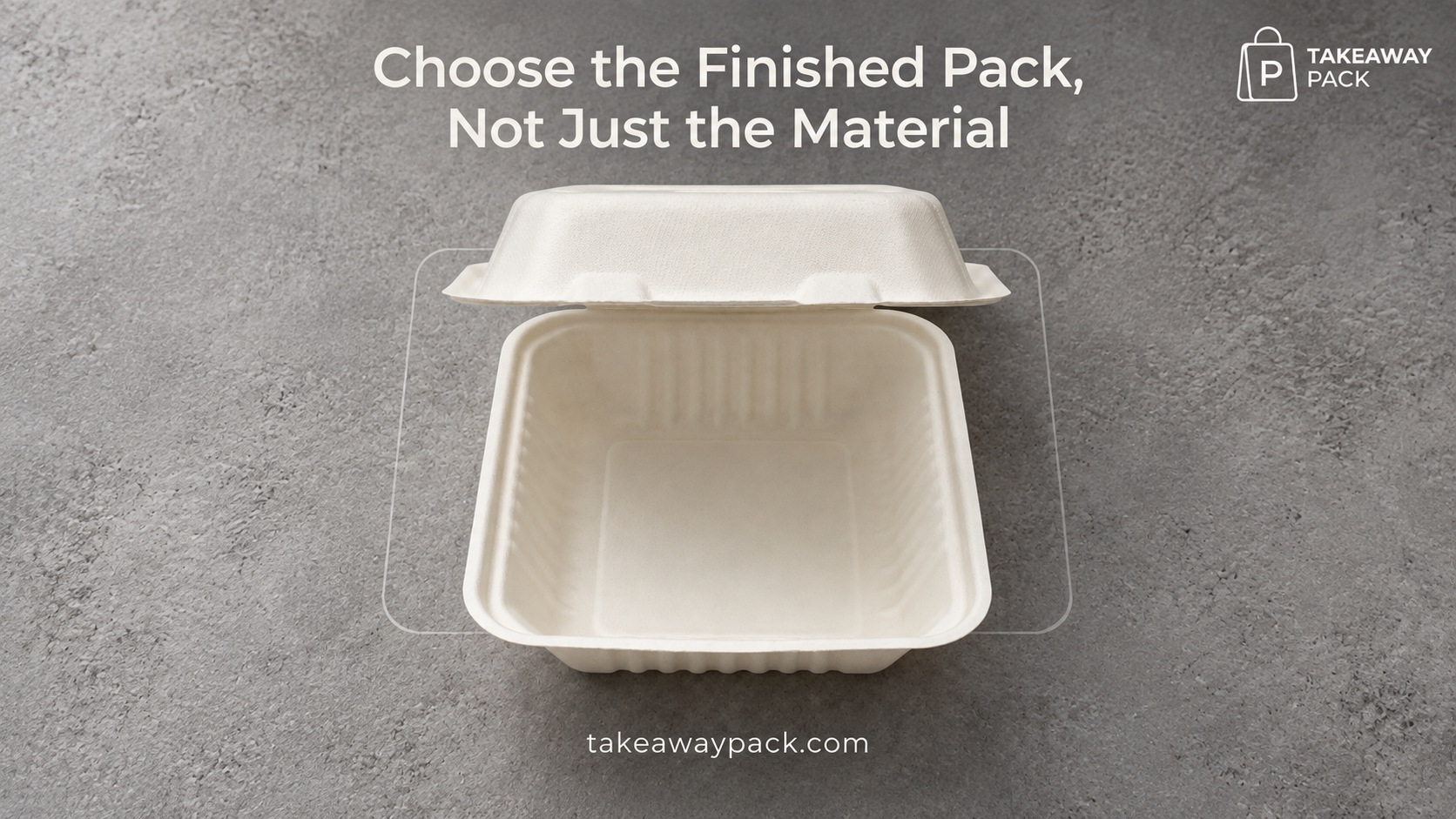 Open white molded-fiber takeaway container on a grey surface.