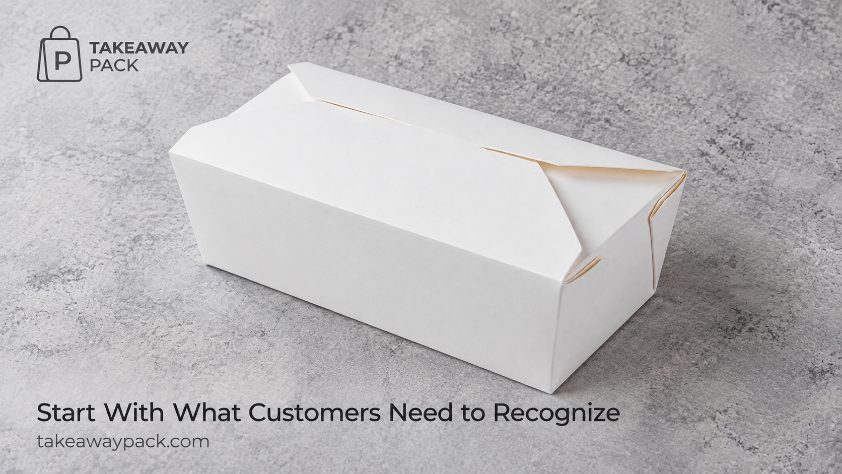 White takeaway box on a grey textured surface.