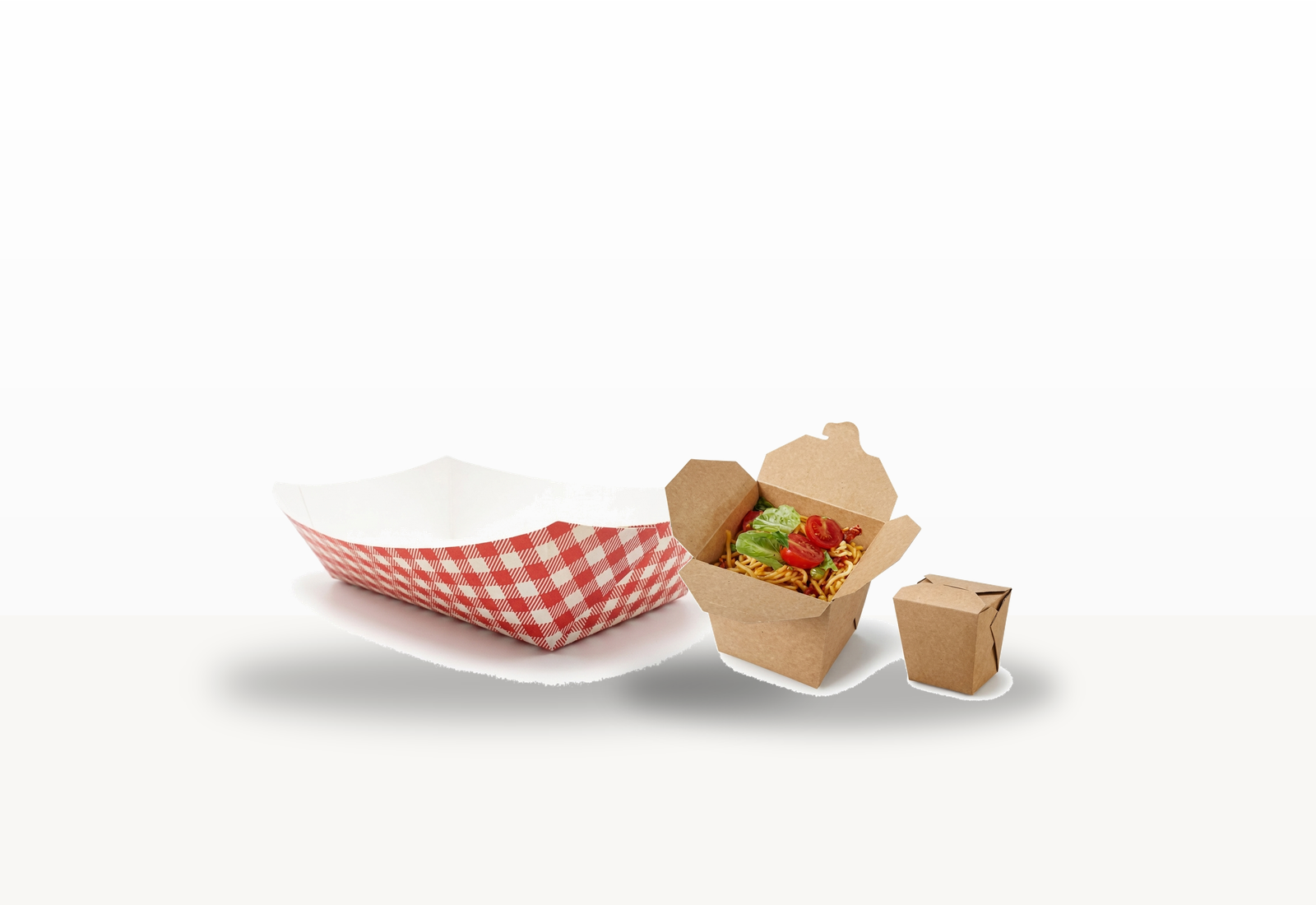 Centered unbranded foodservice packaging assortment including a compartment tray and kraft takeaway boxes