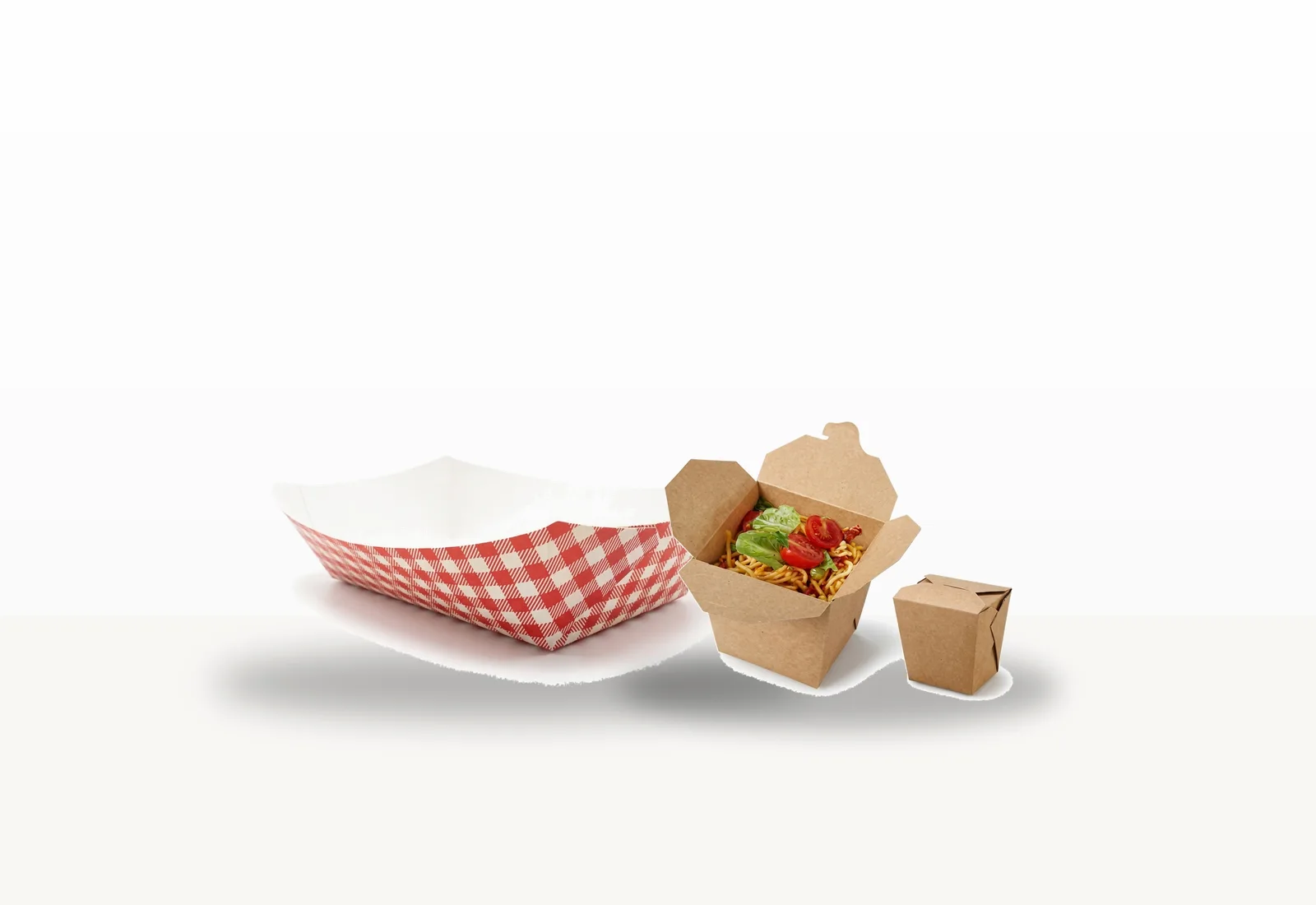 Centered unbranded foodservice packaging assortment including a compartment tray and kraft takeaway boxes