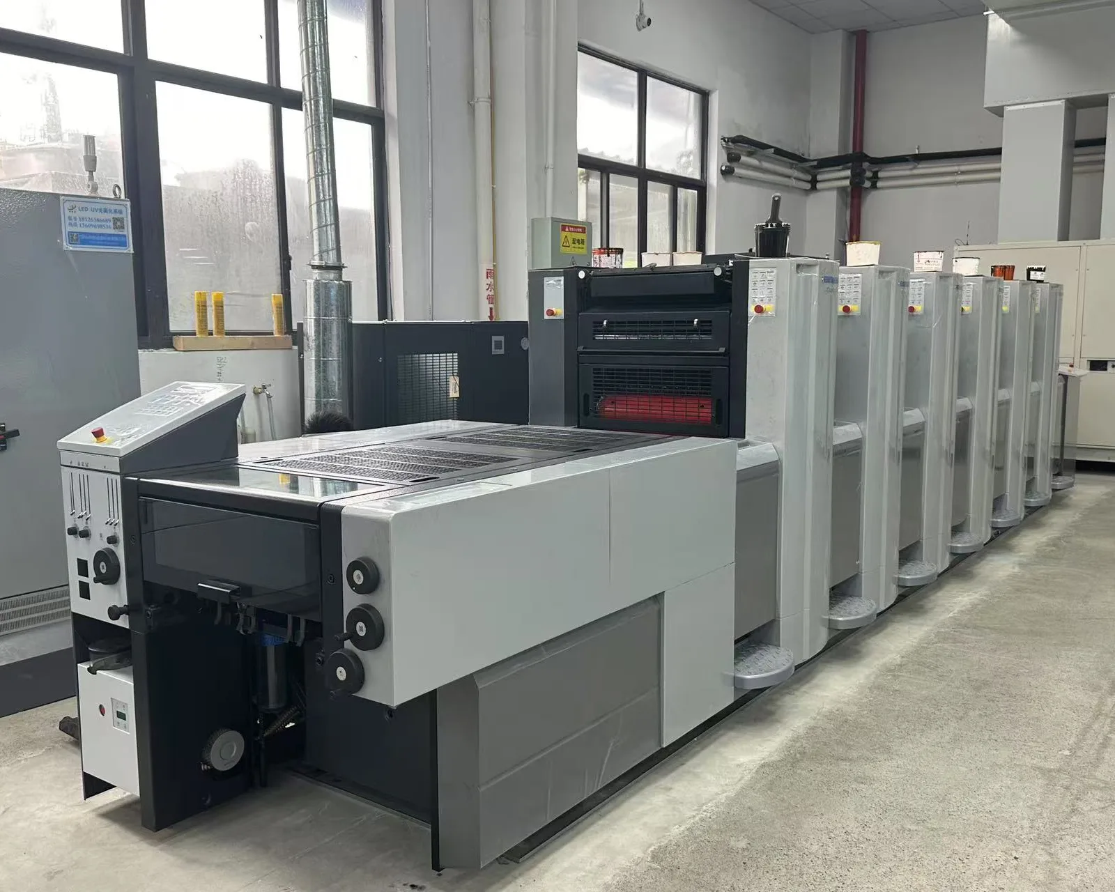 Commercial printing equipment at a food packaging manufacturing facility